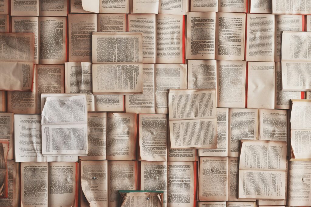 A wall of pages from books