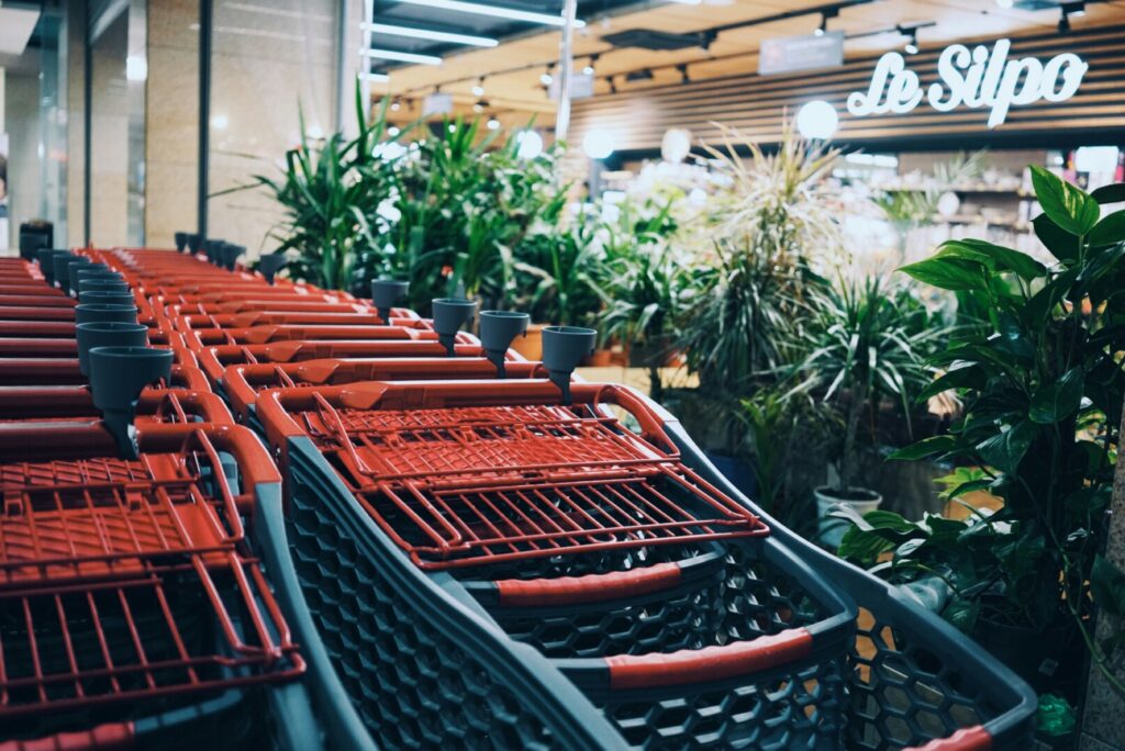 a row of carts at a grocery store
